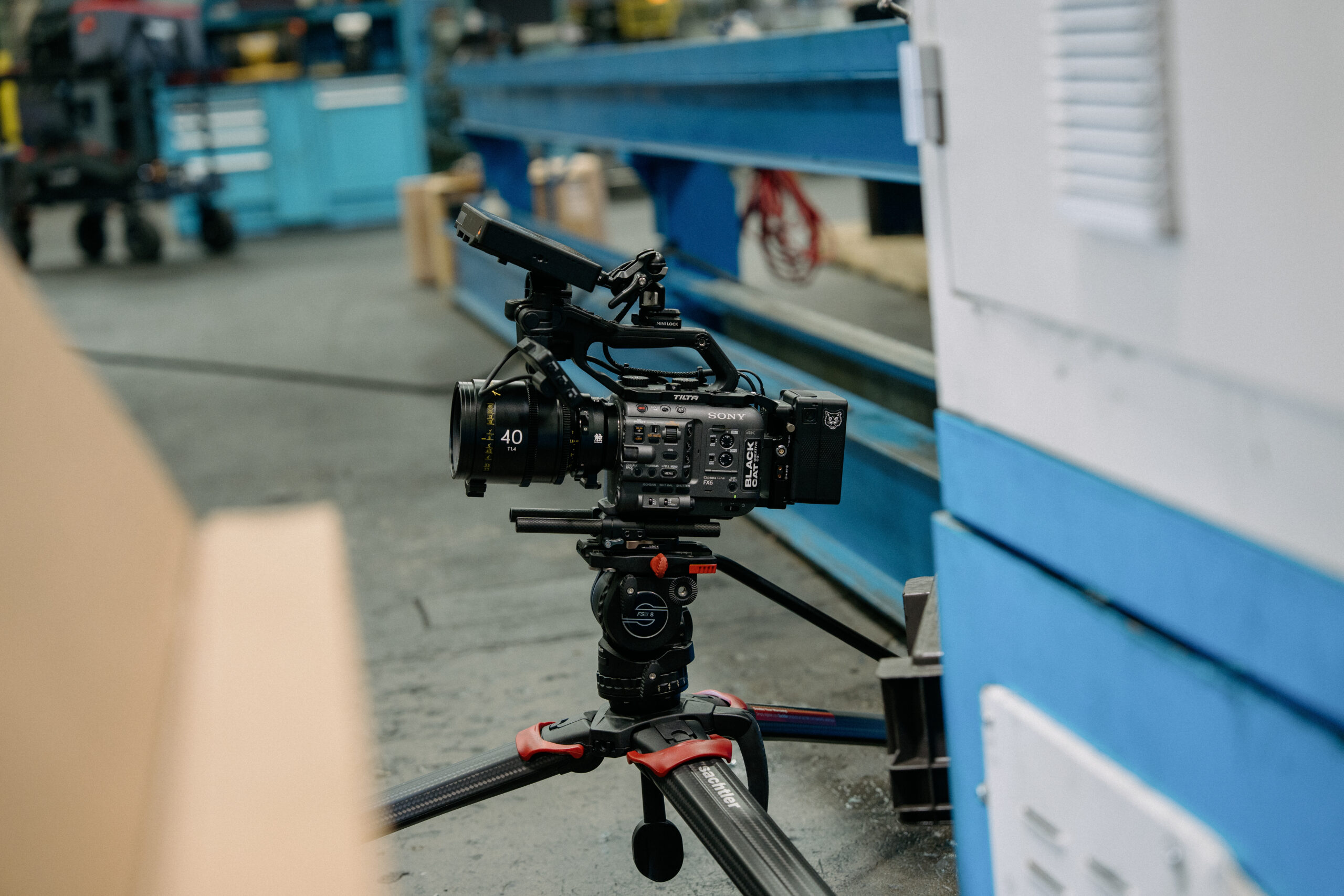 High-quality professional video camera on tripod in studio setting.