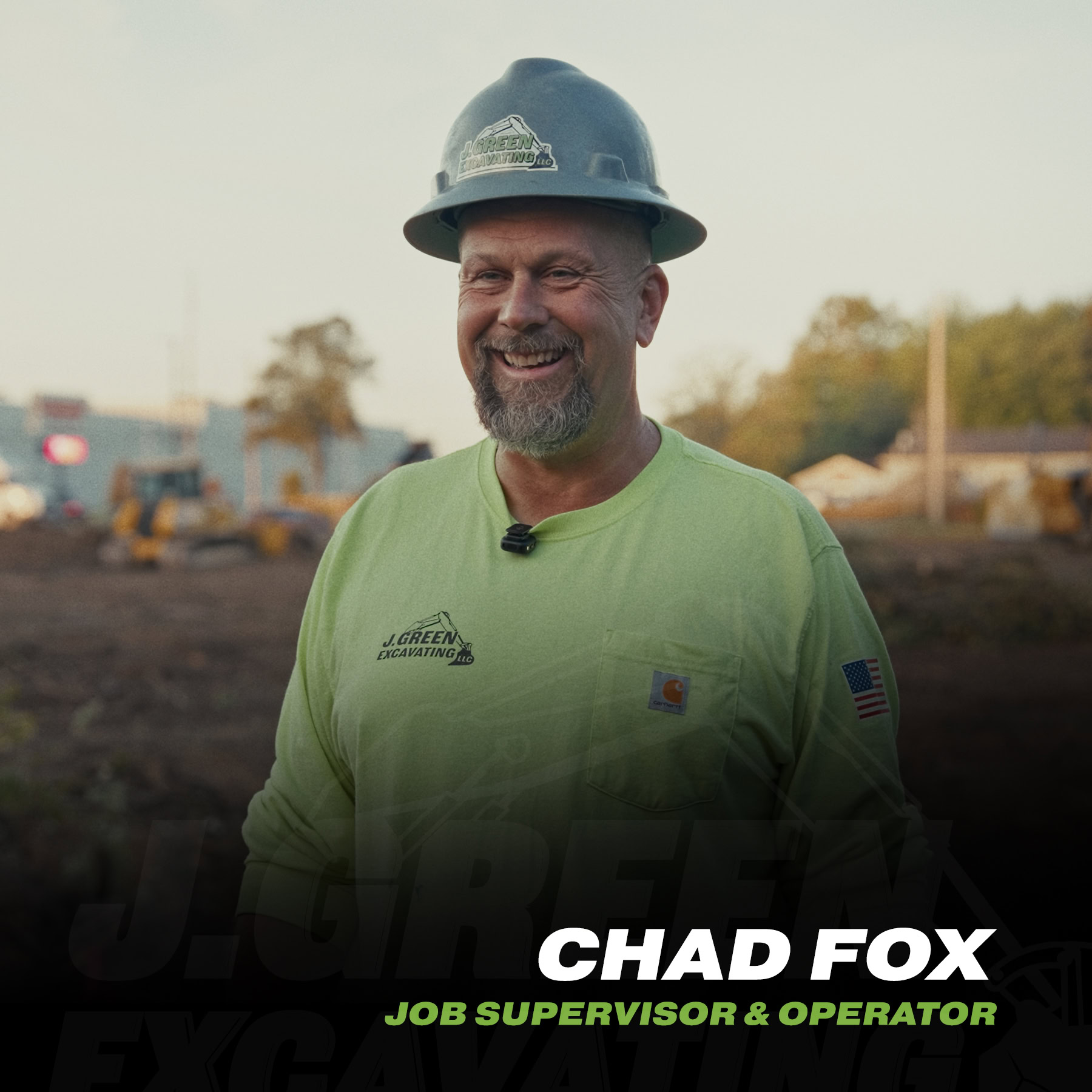 Construction worker Chad Fox smiling in safety gear at site.